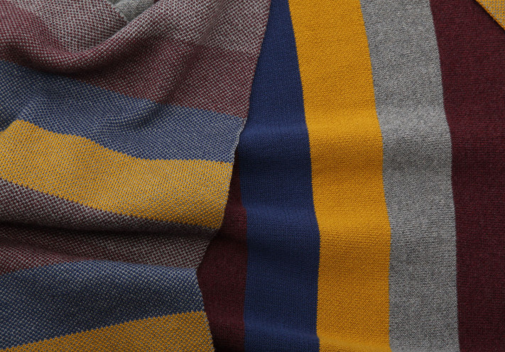 Throw made with fairtrade and organic cotton in blue, lilac, beige and grey