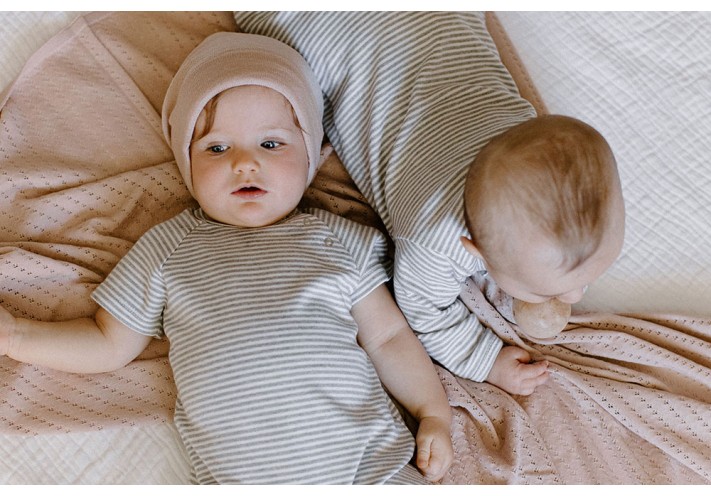 Throw made with fairtrade and organic cotton in blue, lilac, beige and grey